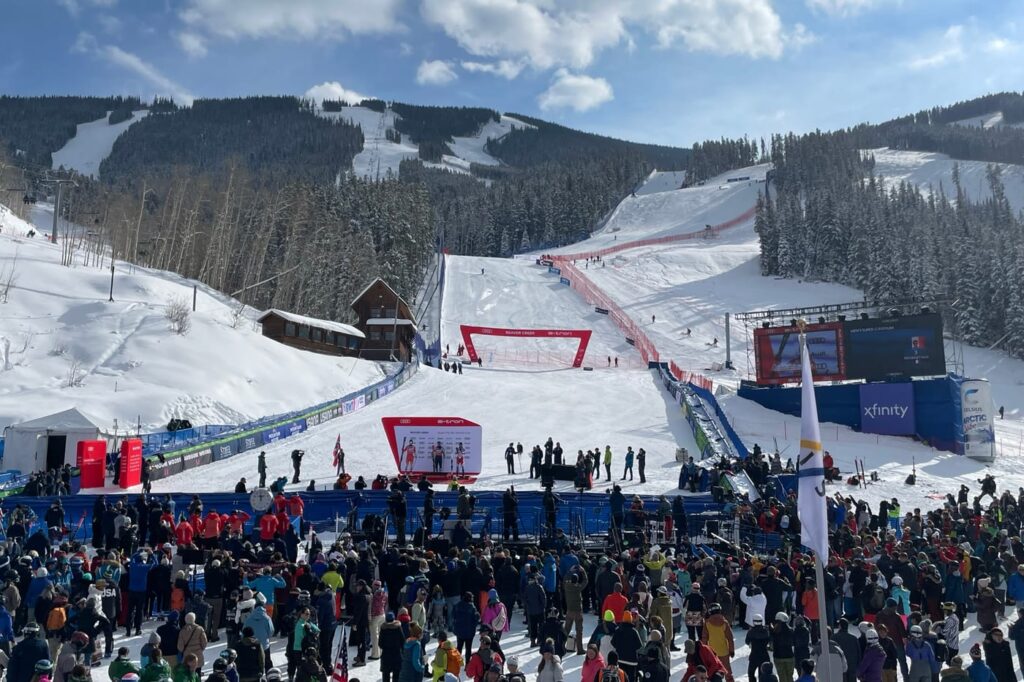 Crowd at the Birds of Prey finish area at Beaver Creek during the Audi FIS Ski World Cup, with the race course running down the mountain behind